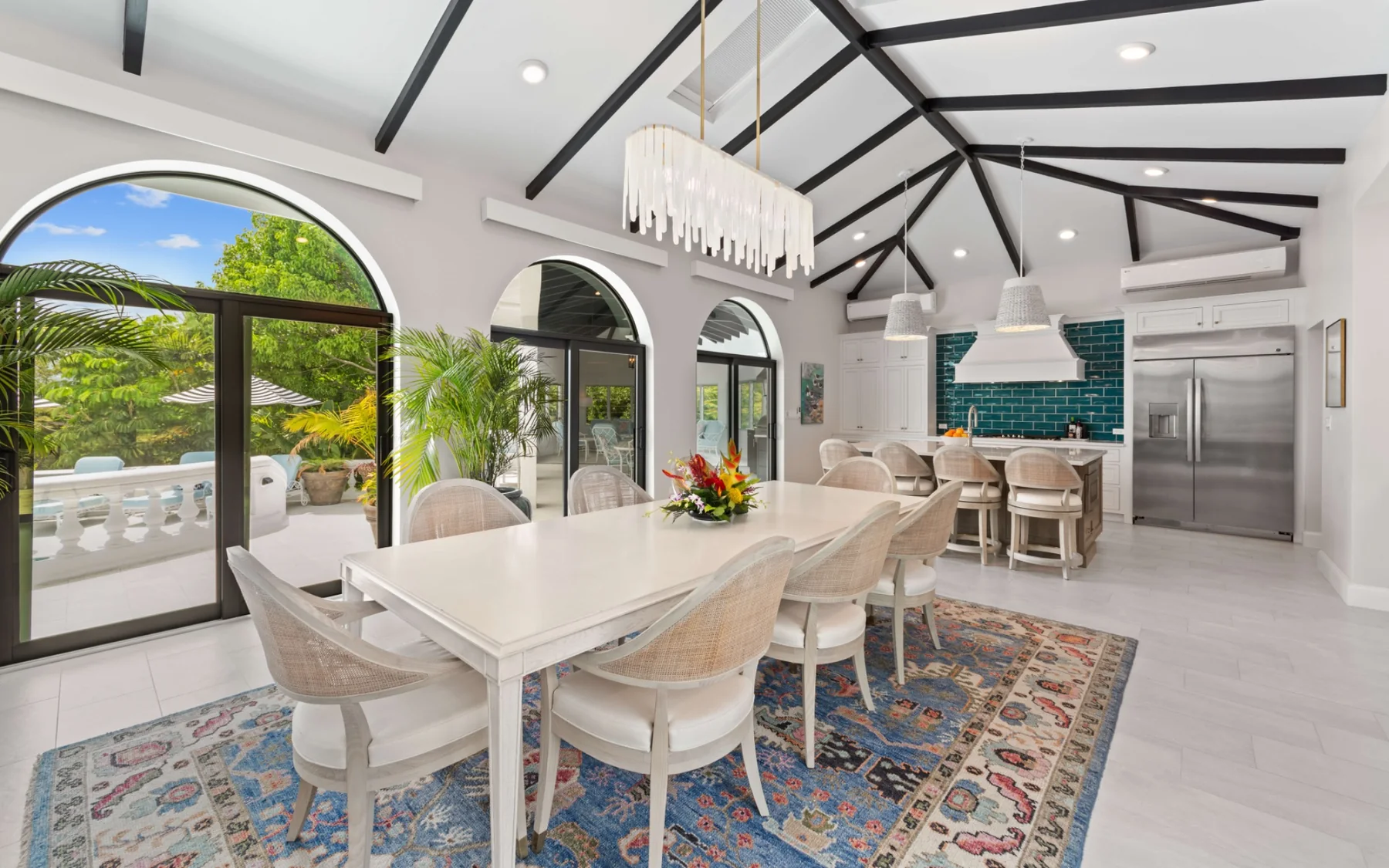 Large indoor dining table and kitchen