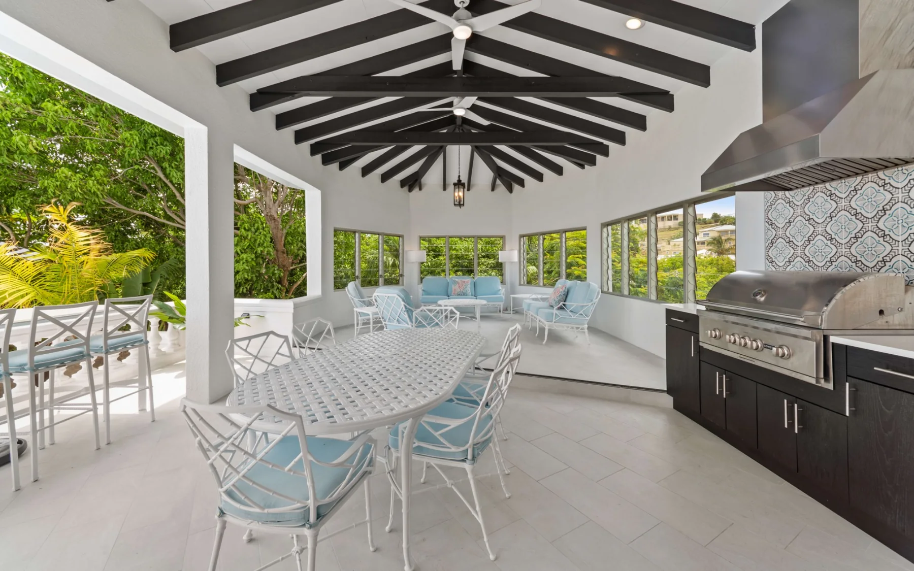 Covered outdoor dining area with built-in grill