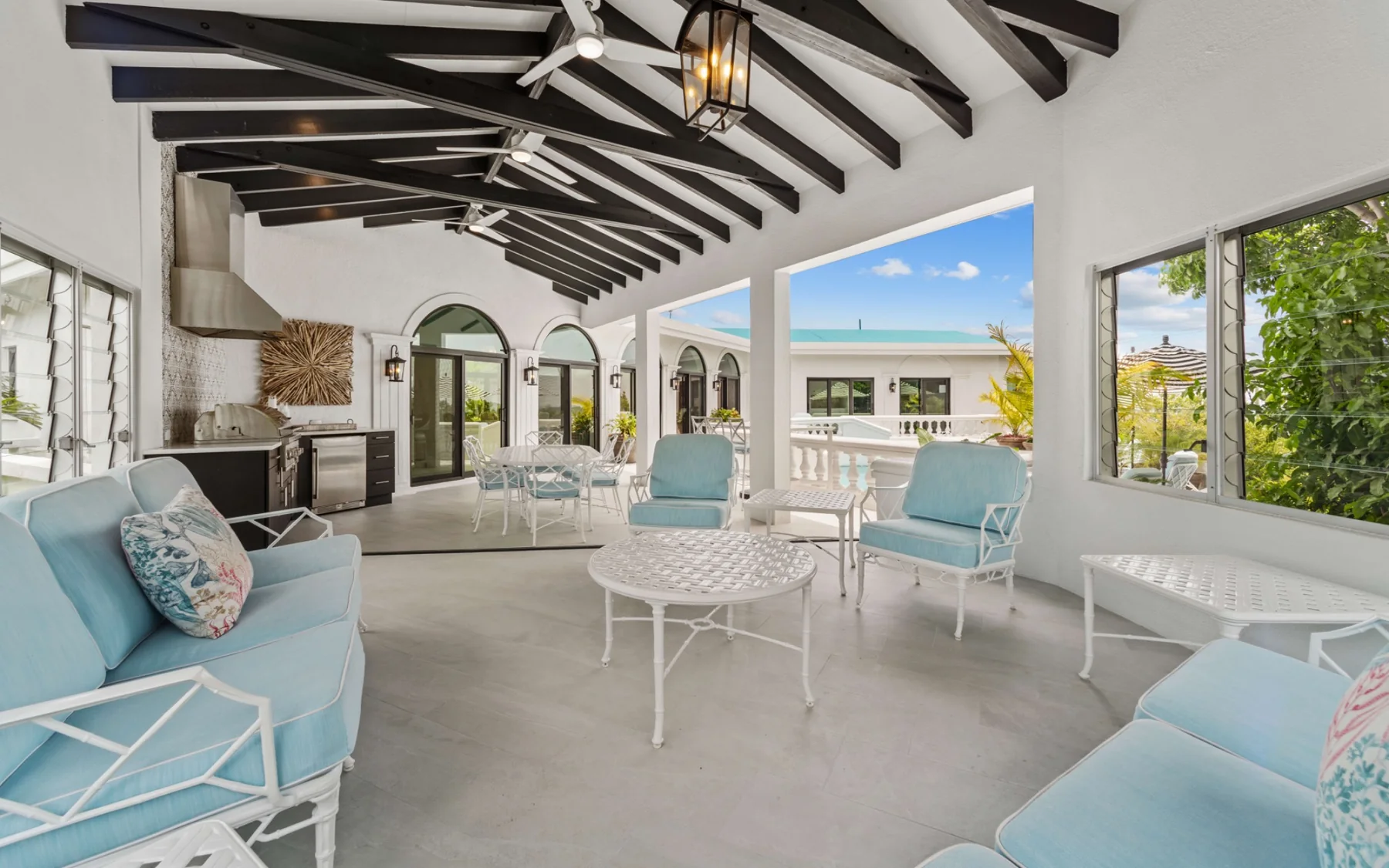 Covered outdoor lounge beside the pool