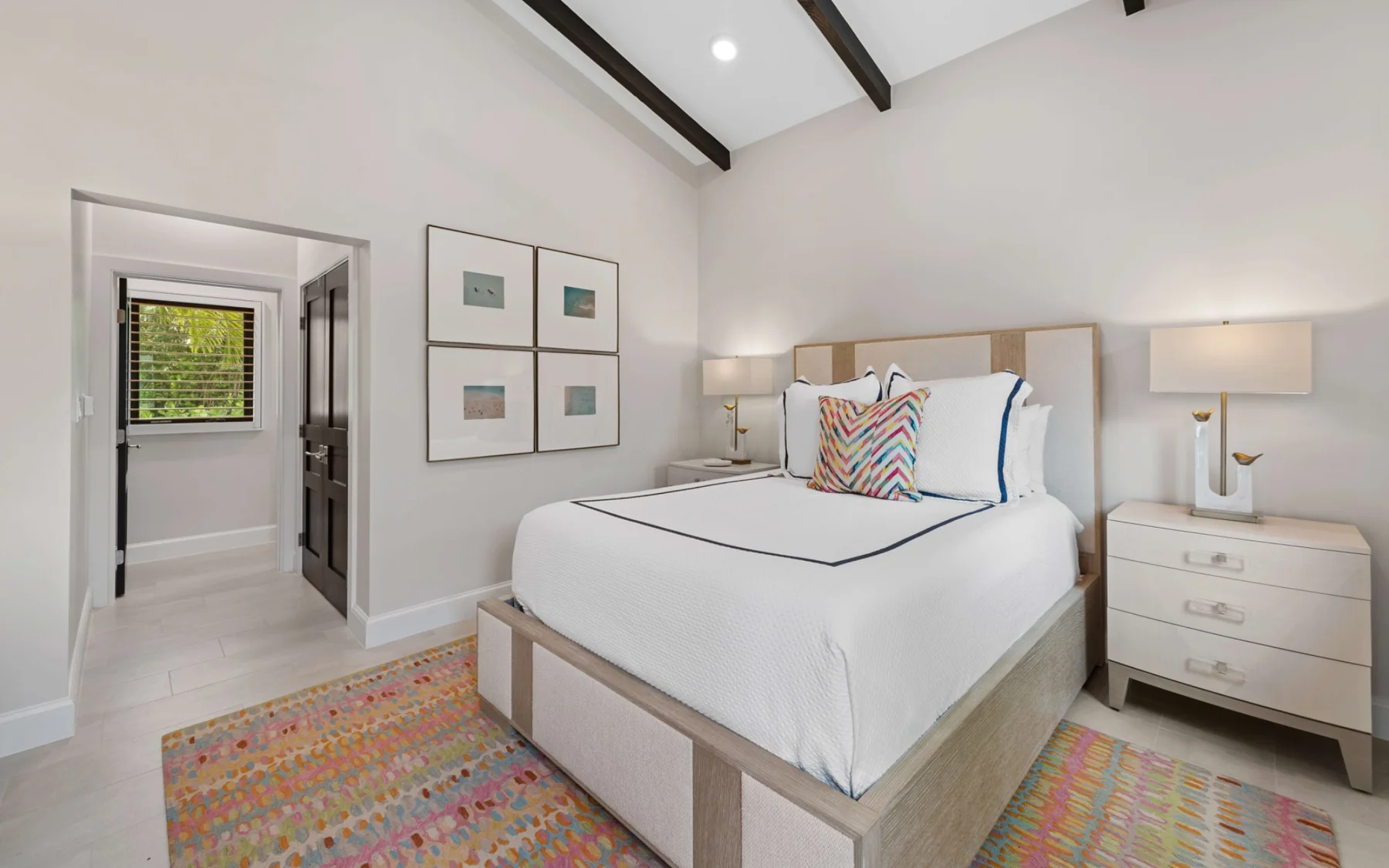 Bright queen bedroom with vaulted ceiling